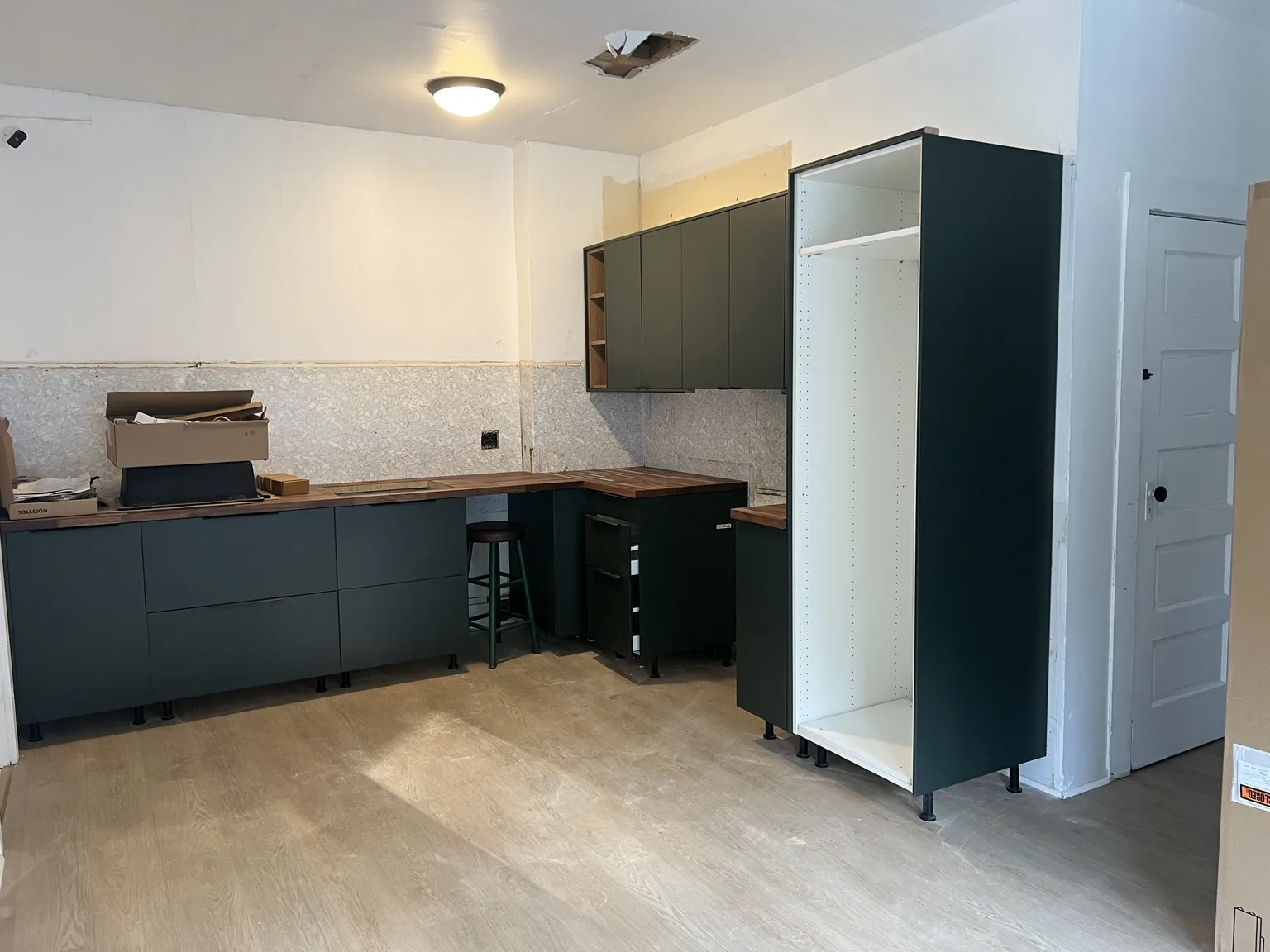 Dark Green Kitchen with Wood Accents